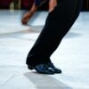 The Rumba is the most popular men's latin dance shoe shown here in black leather and the 1.5" heel, usually used for Latin dancing, shown here on a competitive dancer.
