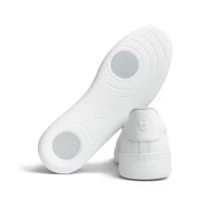 Shows the soles on a pair of Lisbon Groovies Dance Sneaker in soft white leather.